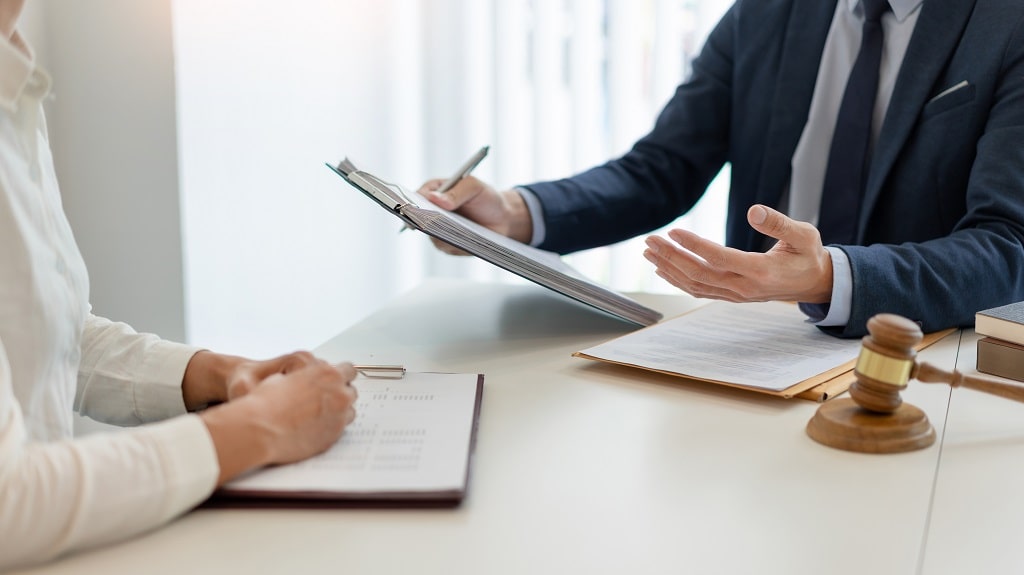 Lawyer discussing documents with a client